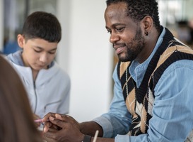 Normal_smiling-african-american-teacher-looking-and-takin-2025-03-08-15-34-41-utc__1_
